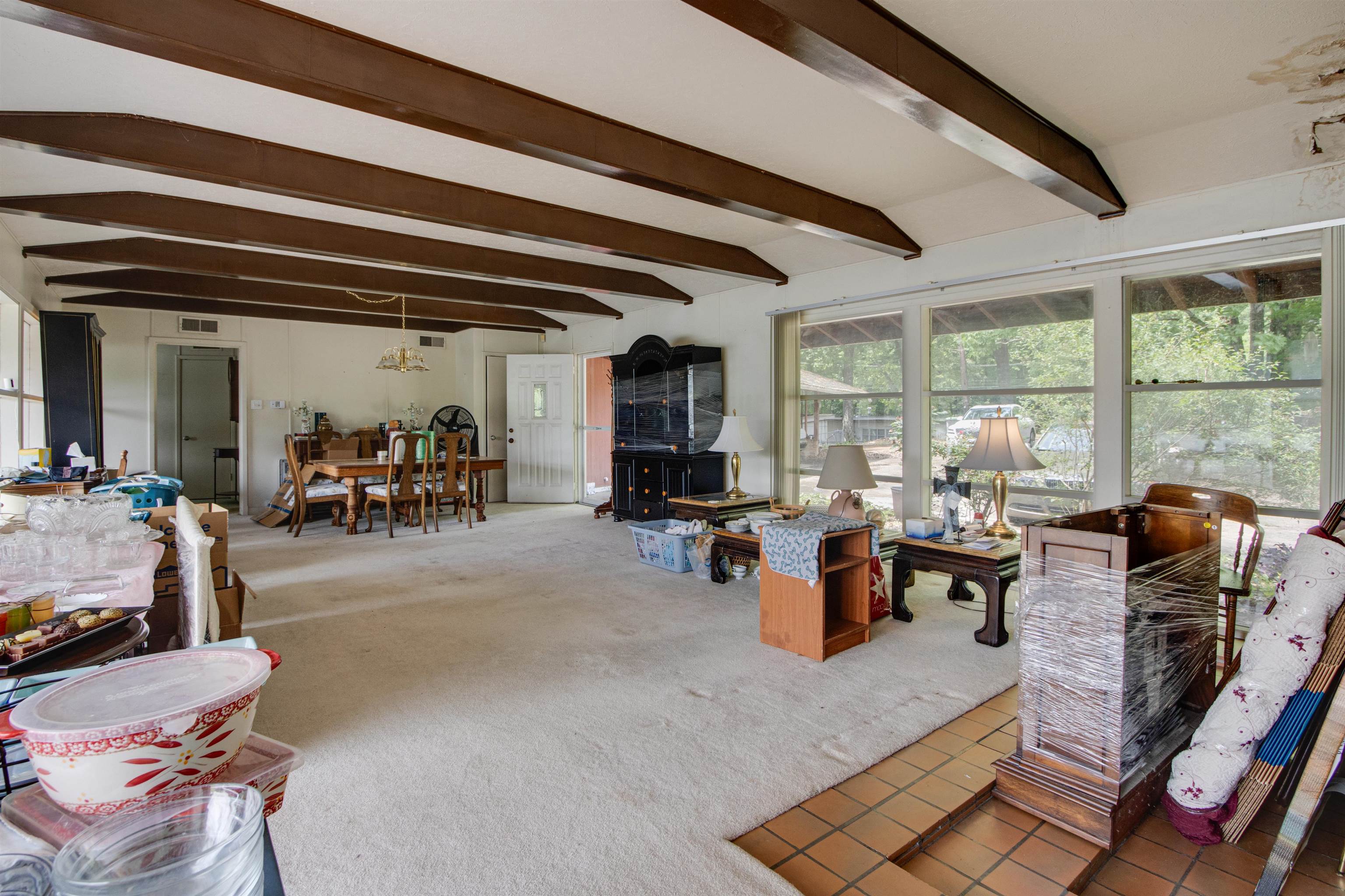 4920 Coro Road Memphis, TN 38109 - Photo 10 of 25 a living room with lots of furniture and chairs
