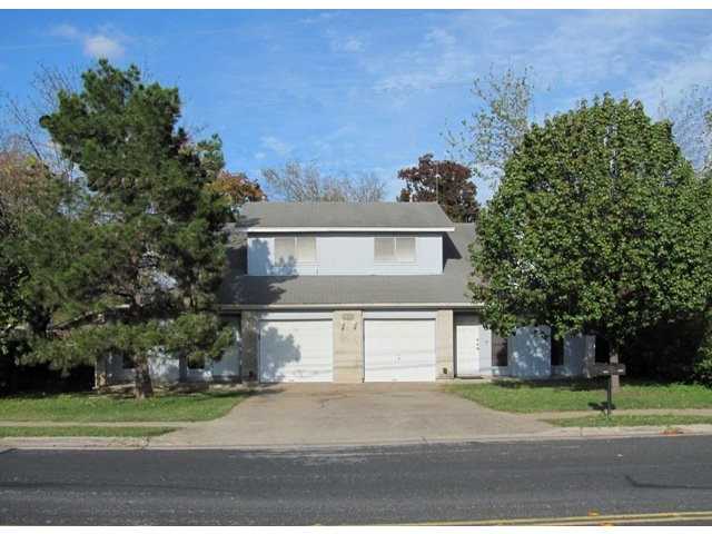 2701 Metcalfe Road Austin, TX 78741 - Photo 1 of 1 a house that has a tree in front of it