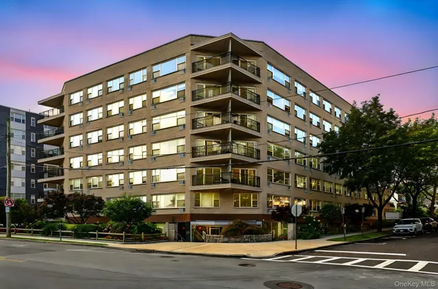 a front view of building with street view