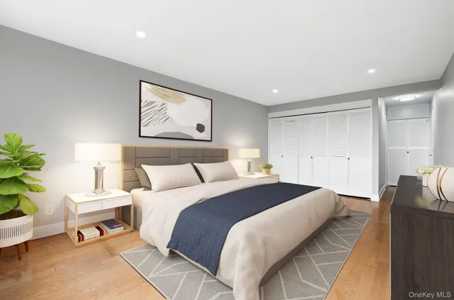 a spacious bedroom with a bed and a couch