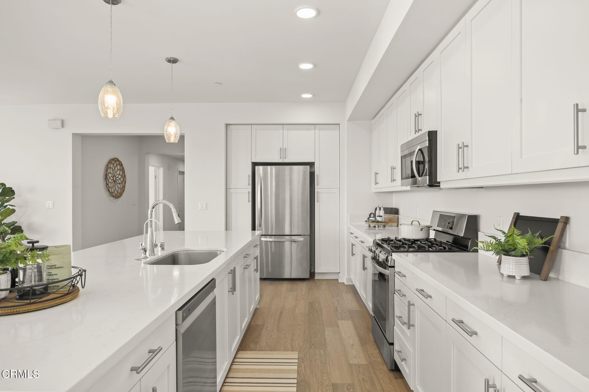 2800 Wagon Wheel Road, Unit 404 Oxnard, CA 93036 - Photo 14 of 43 a kitchen with a sink and refrigerator