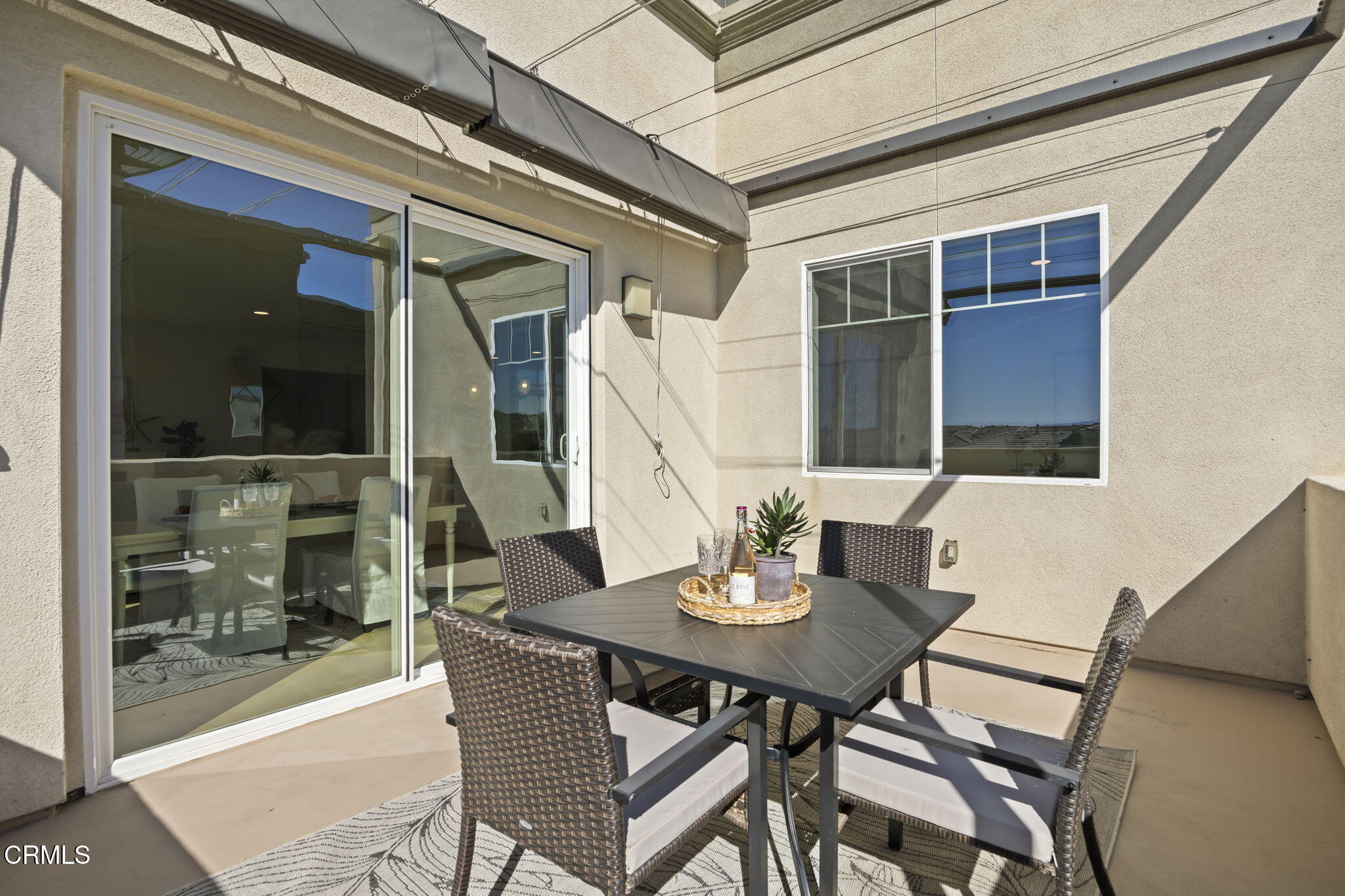 2800 Wagon Wheel Road, Unit 404 Oxnard, CA 93036 - Photo 18 of 43 a view of a dining room with furniture and window