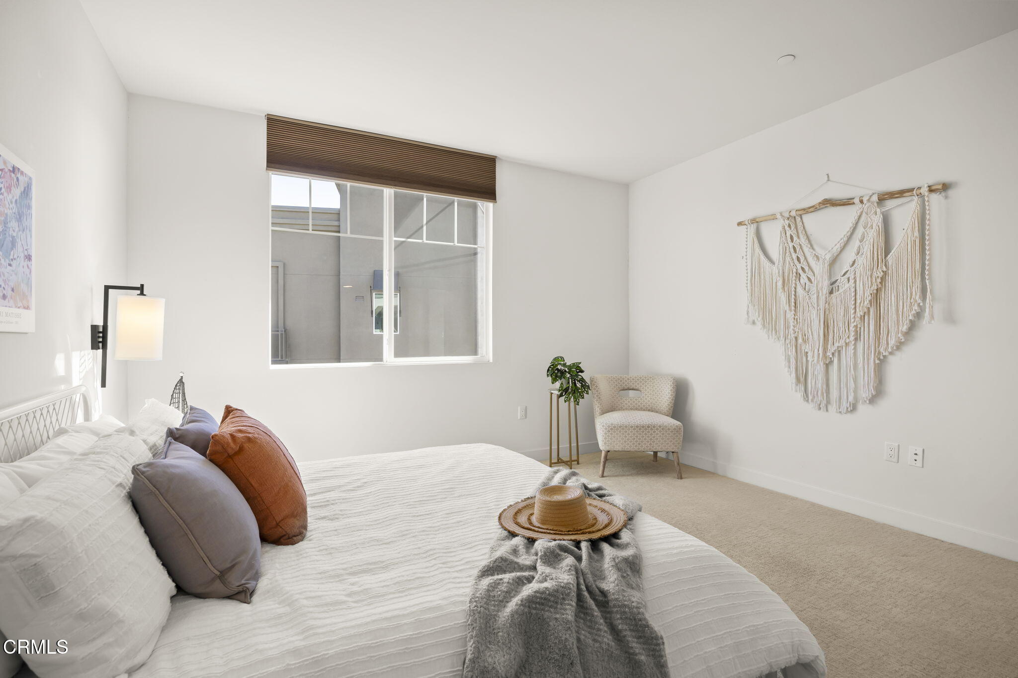 2800 Wagon Wheel Road, Unit 404 Oxnard, CA 93036 - Photo 25 of 43 a bedroom with a bed and wooden floor