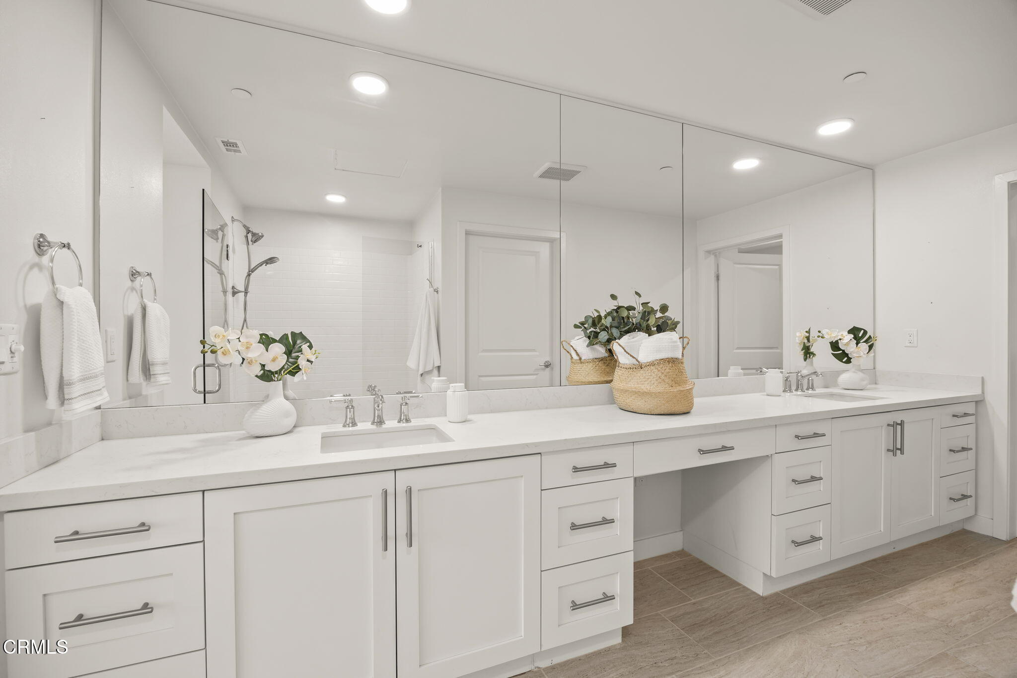 2800 Wagon Wheel Road, Unit 404 Oxnard, CA 93036 - Photo 28 of 43 a bathroom with a double vanity sink mirror and double