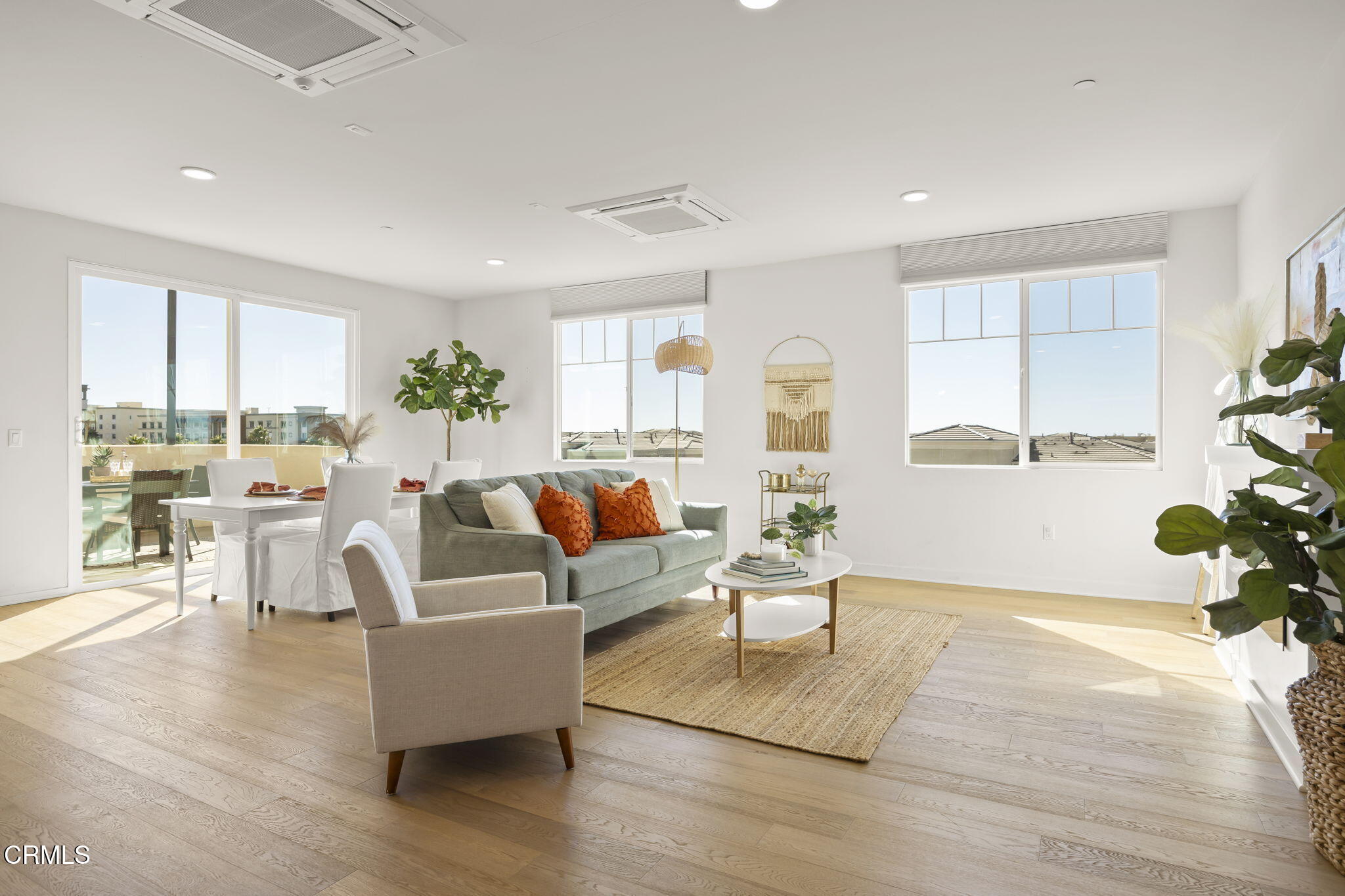2800 Wagon Wheel Road, Unit 404 Oxnard, CA 93036 - Photo 5 of 43 a living room with fireplace furniture and a wooden floor