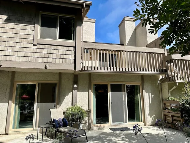 a view of a house with entrance space and windows