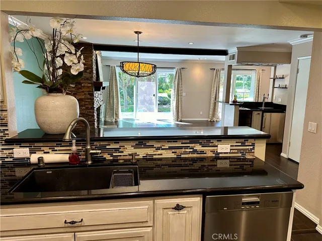 a close view of kitchen countertops with wooden floor