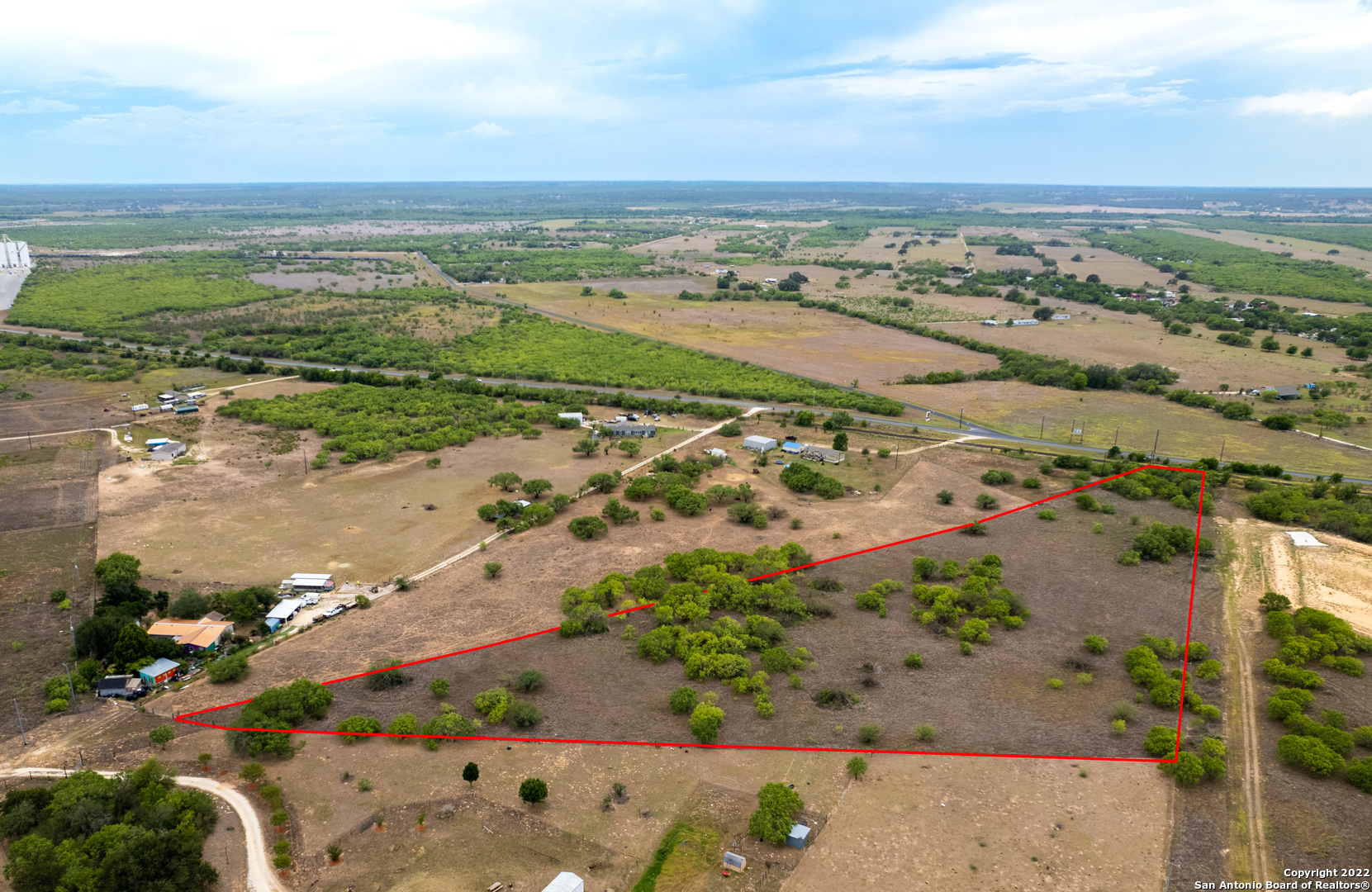 an aerial view of ocean with beach