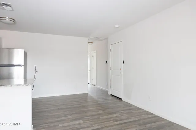 a view of a livingroom with wooden floor