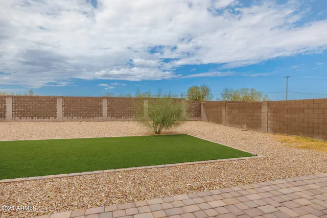 a view of backyard with ocean view