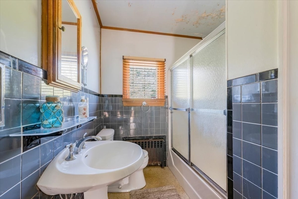 70 Hedge Road Plymouth, MA 02360 - Photo 28 of 41 a bathroom with a sink and a mirror