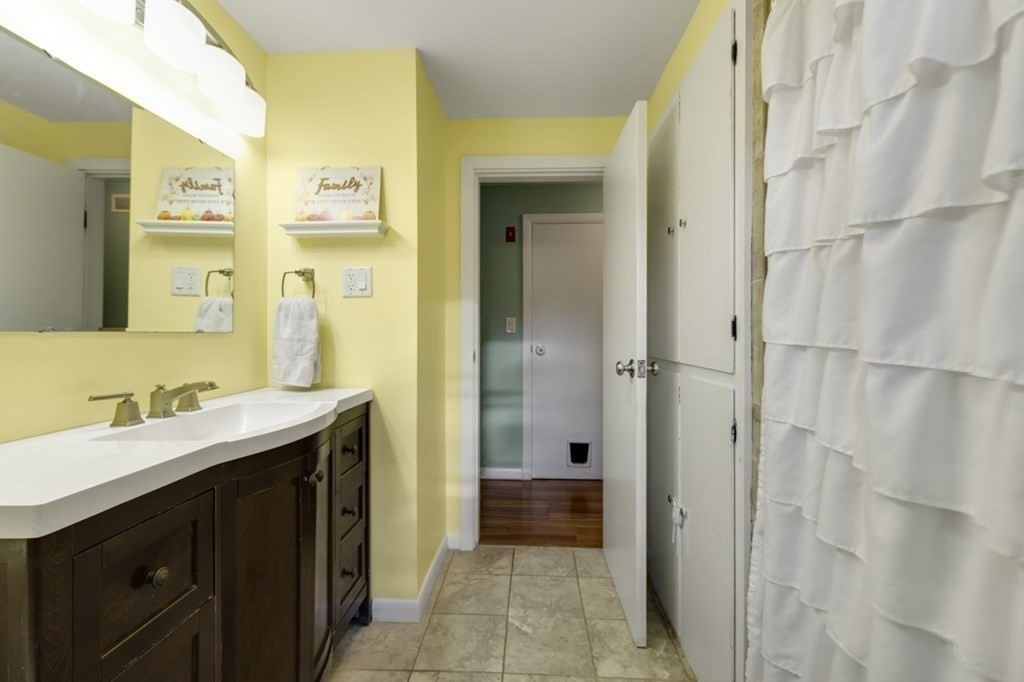 224 Lancaster Road Berlin, MA 01503 - Photo 17 of 32 a bathroom with a sink and a mirror