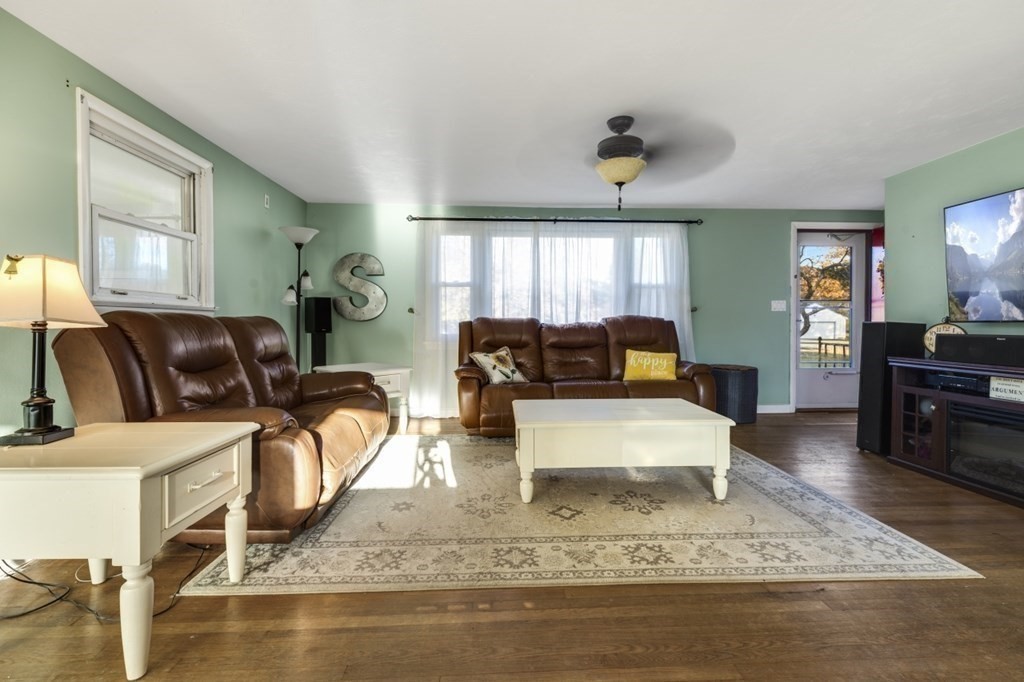 224 Lancaster Road Berlin, MA 01503 - Photo 7 of 32 a living room with furniture and wooden floor