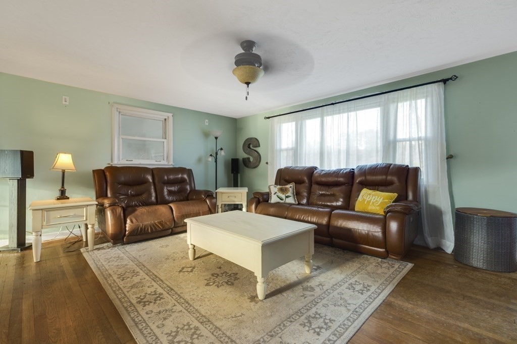 224 Lancaster Road Berlin, MA 01503 - Photo 8 of 32 a living room with furniture and a rug