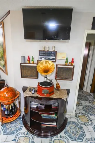 a room with furniture and flat screen tv