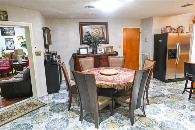 a dining room with furniture and window