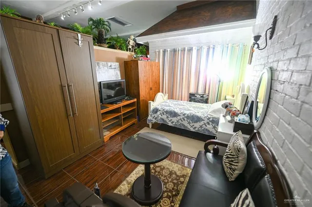 a living room filled with furniture and a potted plant