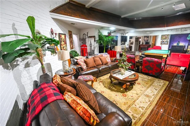 a room with furniture a rug and a window