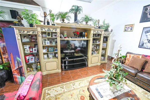 a outdoor living space with furniture and a flat screen tv