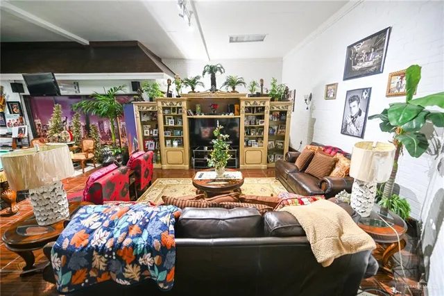 a bedroom with a bed and a couch