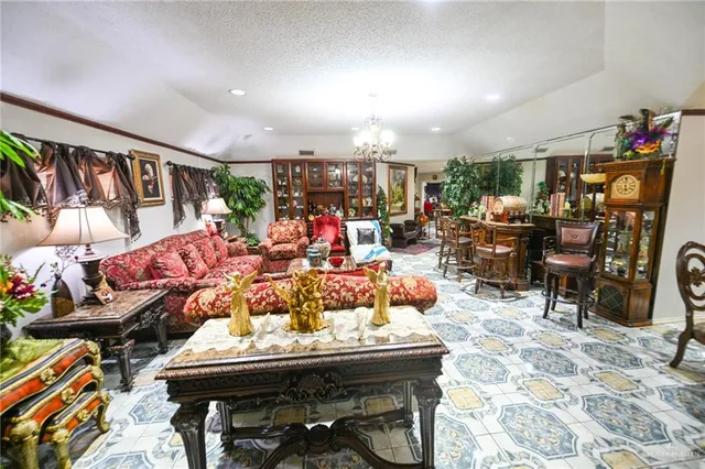 a living room with lots of furniture and a view of dining table
