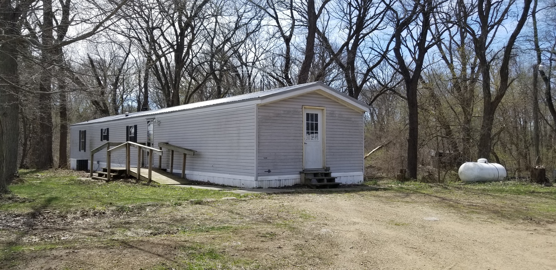1898 Richardson Road Amboy, IL 61310 - Photo 3 of 8 a view of a house with backyard and trees
