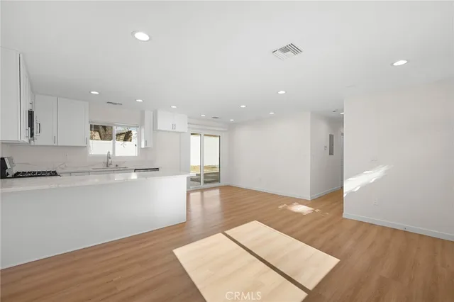 a view of kitchen with wooden floor