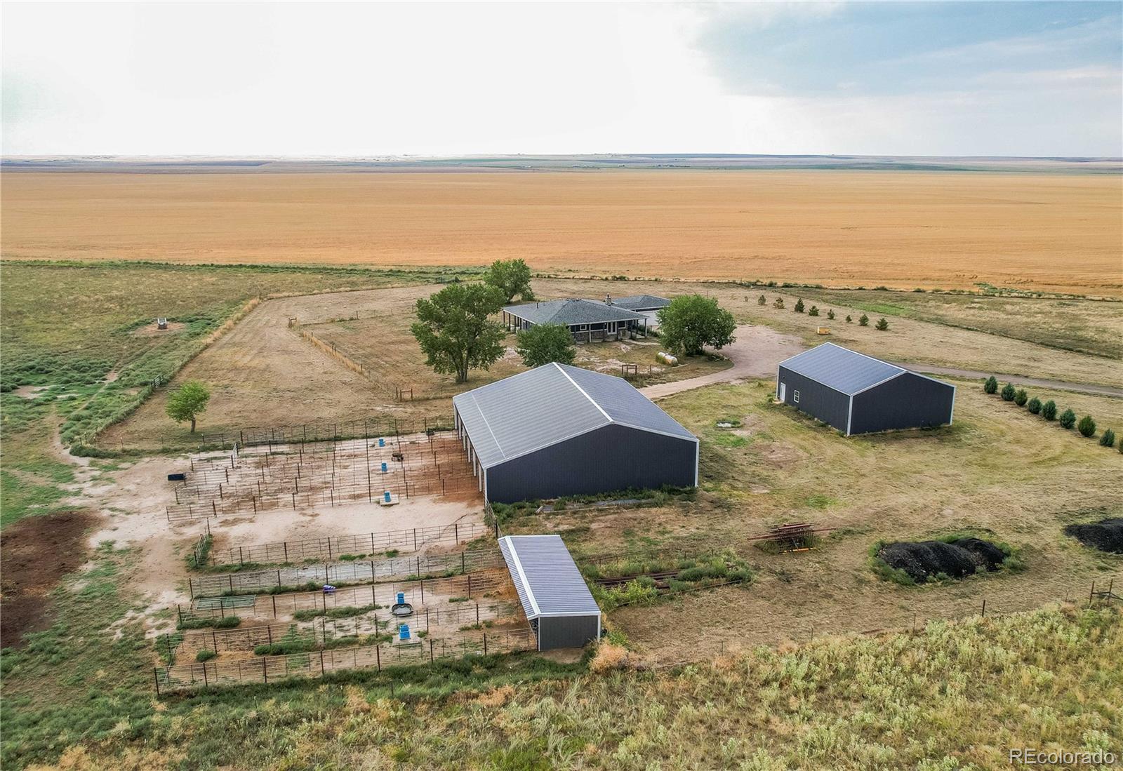 6001 Xmore Road Byers, CO 80103 - Photo 1 of 48 an aerial view of residential houses with outdoor space