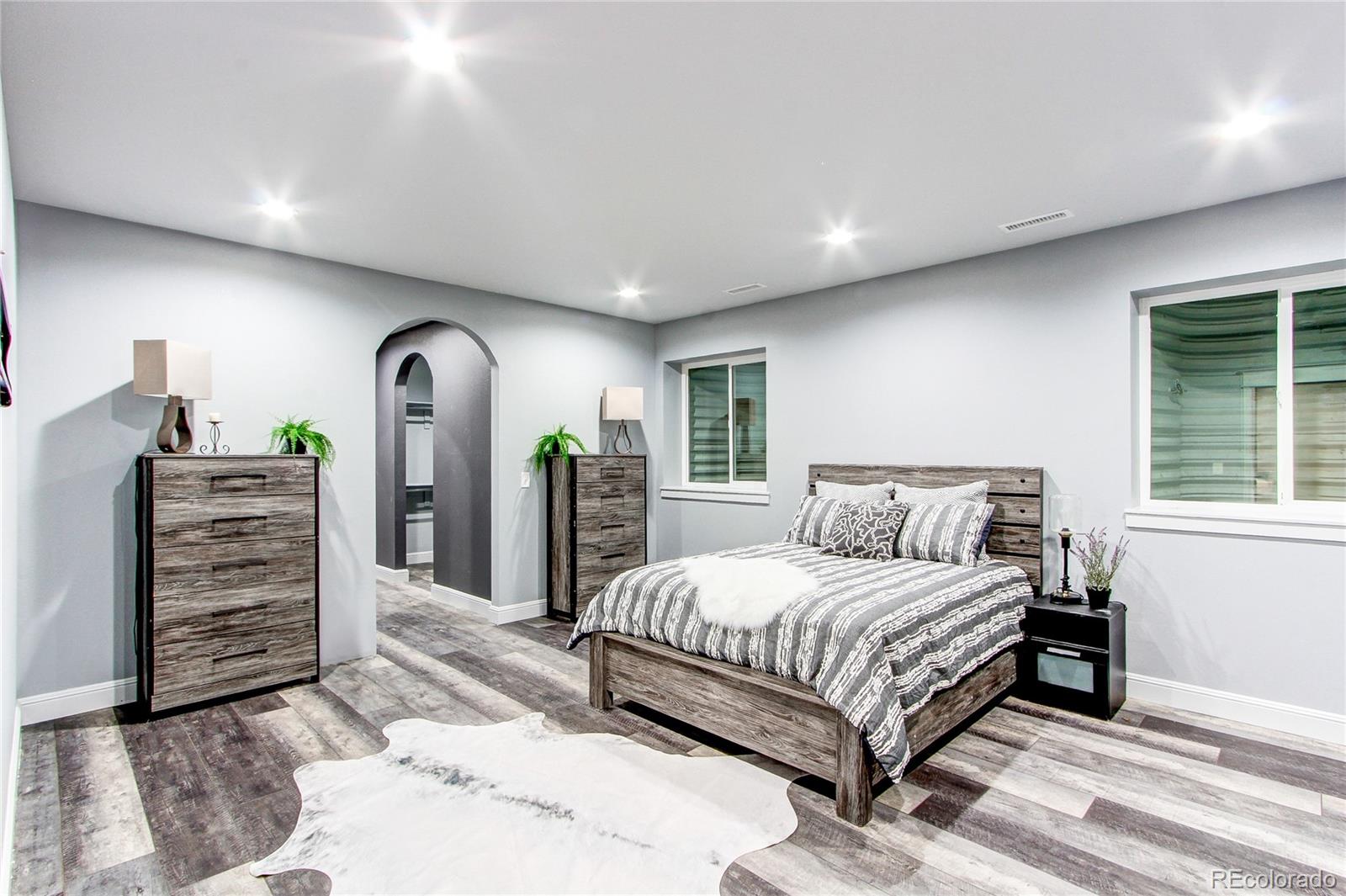 6001 Xmore Road Byers, CO 80103 - Photo 11 of 48 a bedroom with a large bed and dresser