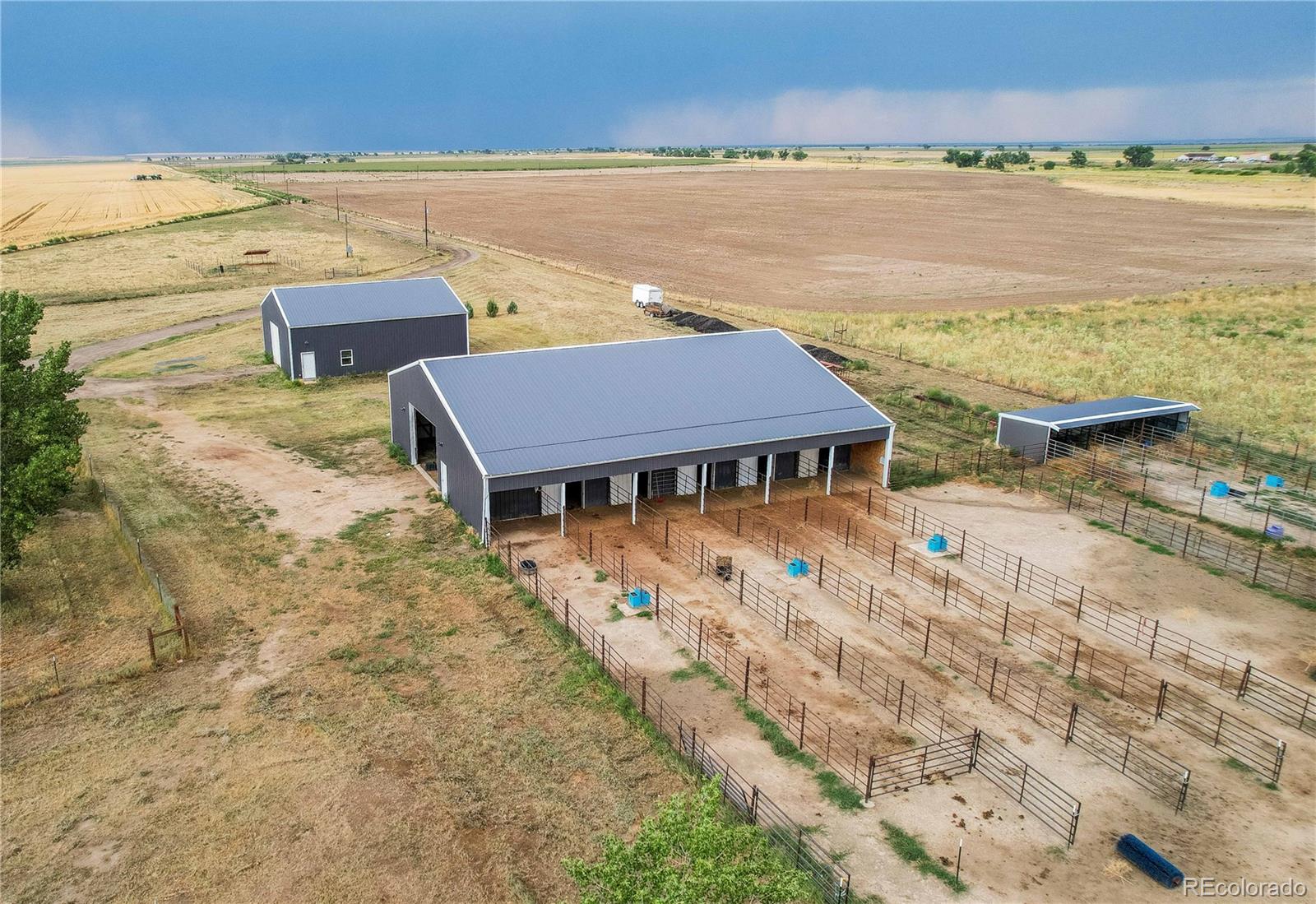 6001 Xmore Road Byers, CO 80103 - Photo 23 of 48 a aerial view of a house with a lake view
