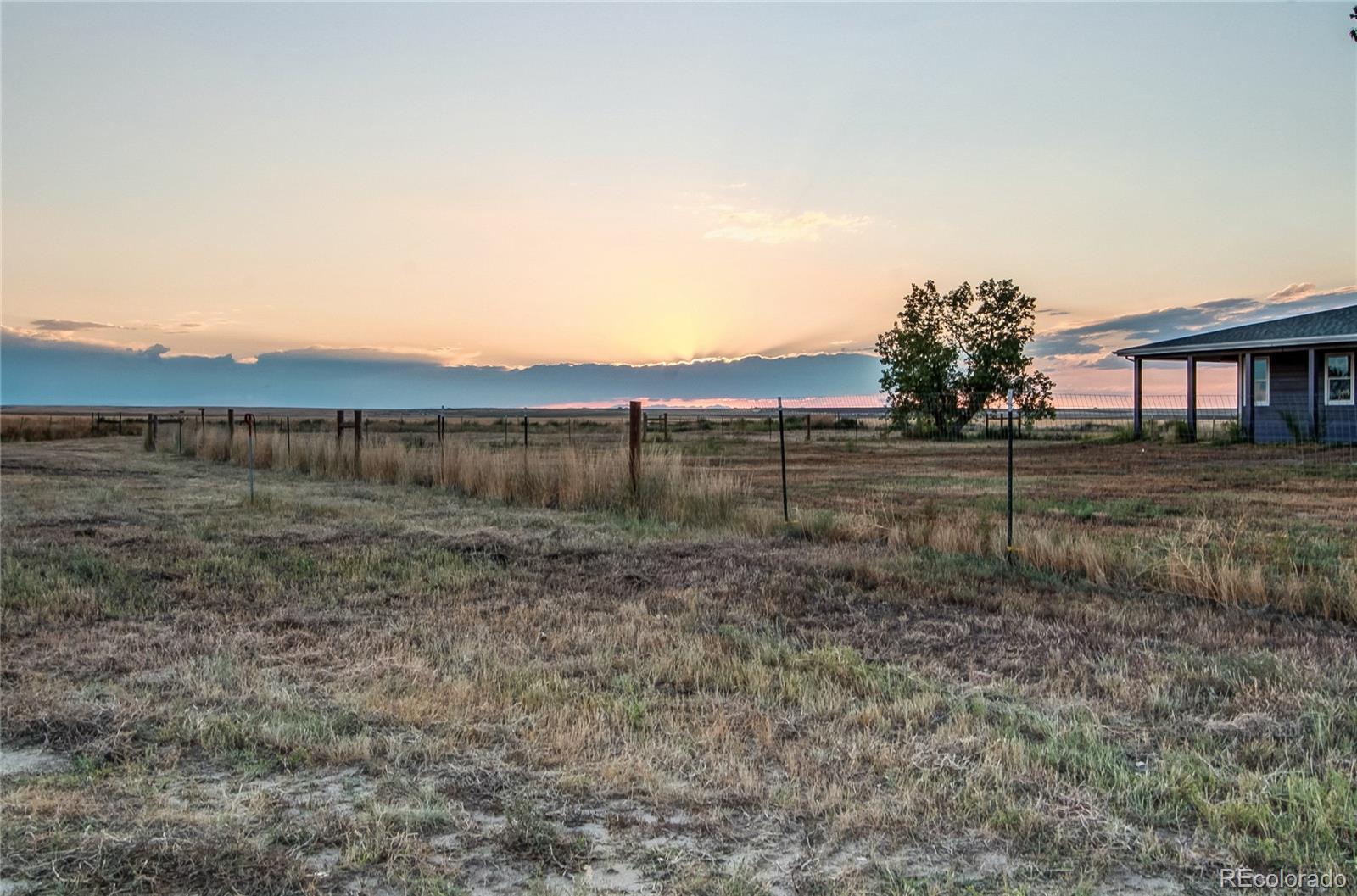 6001 Xmore Road Byers, CO 80103 - Photo 31 of 48 a view of a backyard