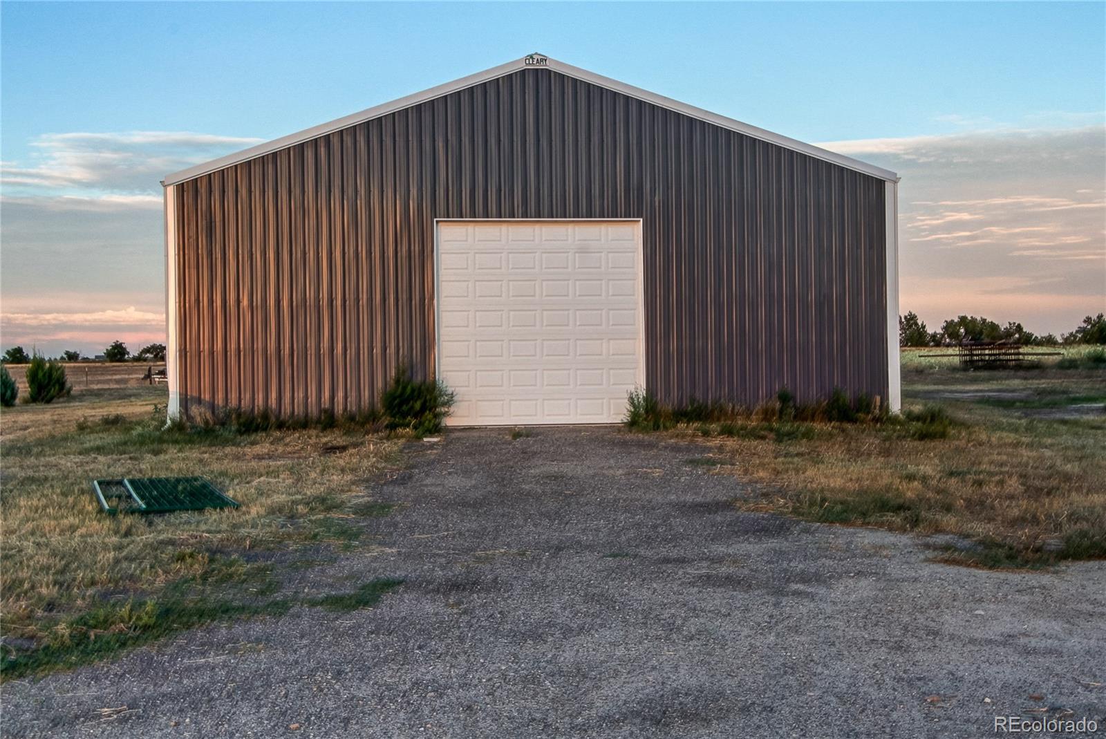 6001 Xmore Road Byers, CO 80103 - Photo 34 of 48 a view of a house with backyard