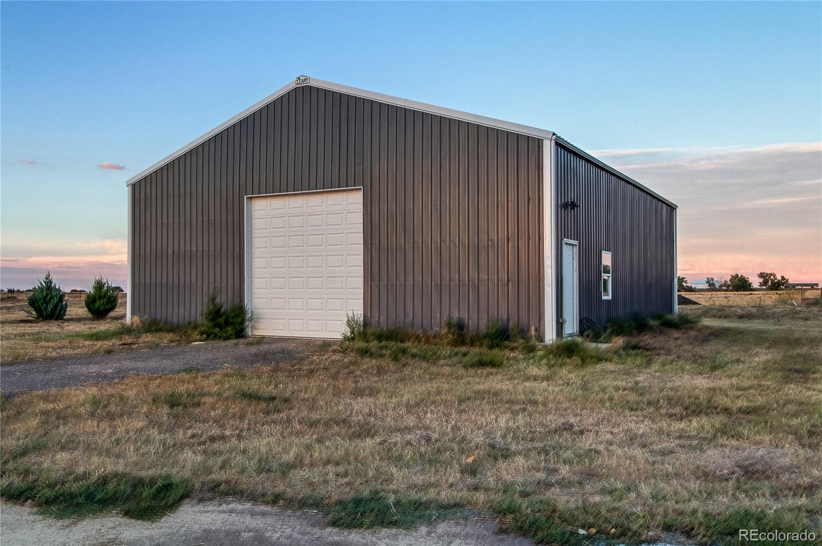 6001 Xmore Road Byers, CO 80103 - Photo 35 of 48 a backyard of a house