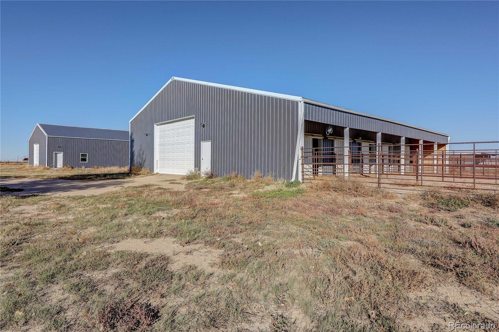6001 Xmore Road Byers, CO 80103 - Photo 39 of 48 a view of a house with backyard