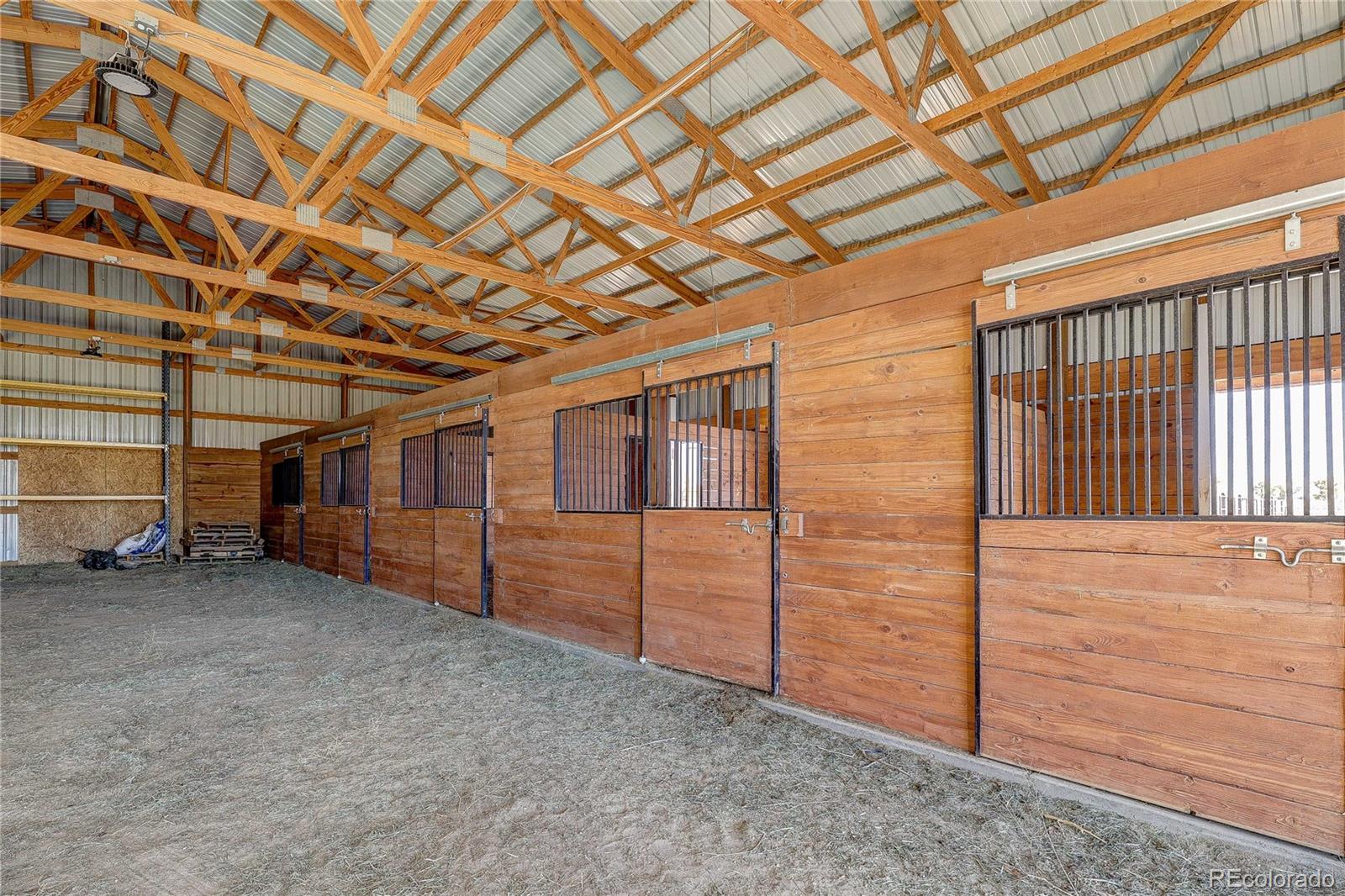 6001 Xmore Road Byers, CO 80103 - Photo 42 of 48 a view of a room with wooden walls