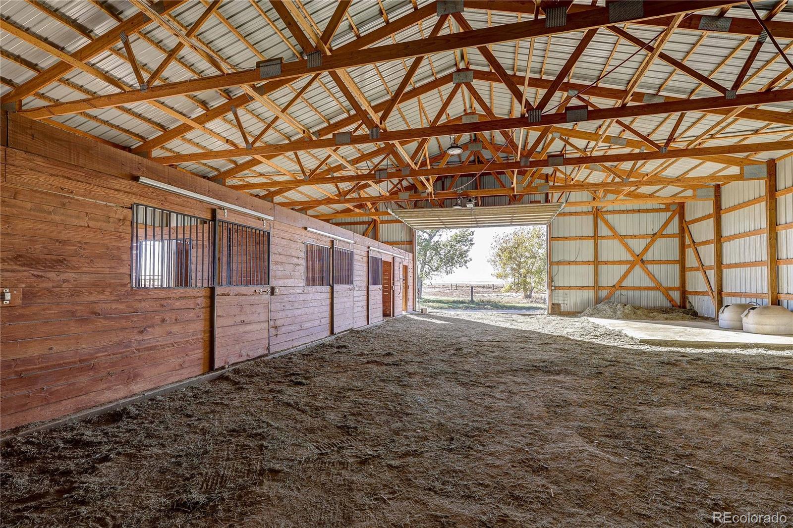 6001 Xmore Road Byers, CO 80103 - Photo 44 of 48 a view of a backyard of a house
