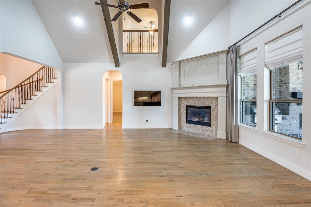 10482 Tobias Lane Frisco, TX 75033 - Photo 11 of 40 a view of an empty room with a fireplace and a window