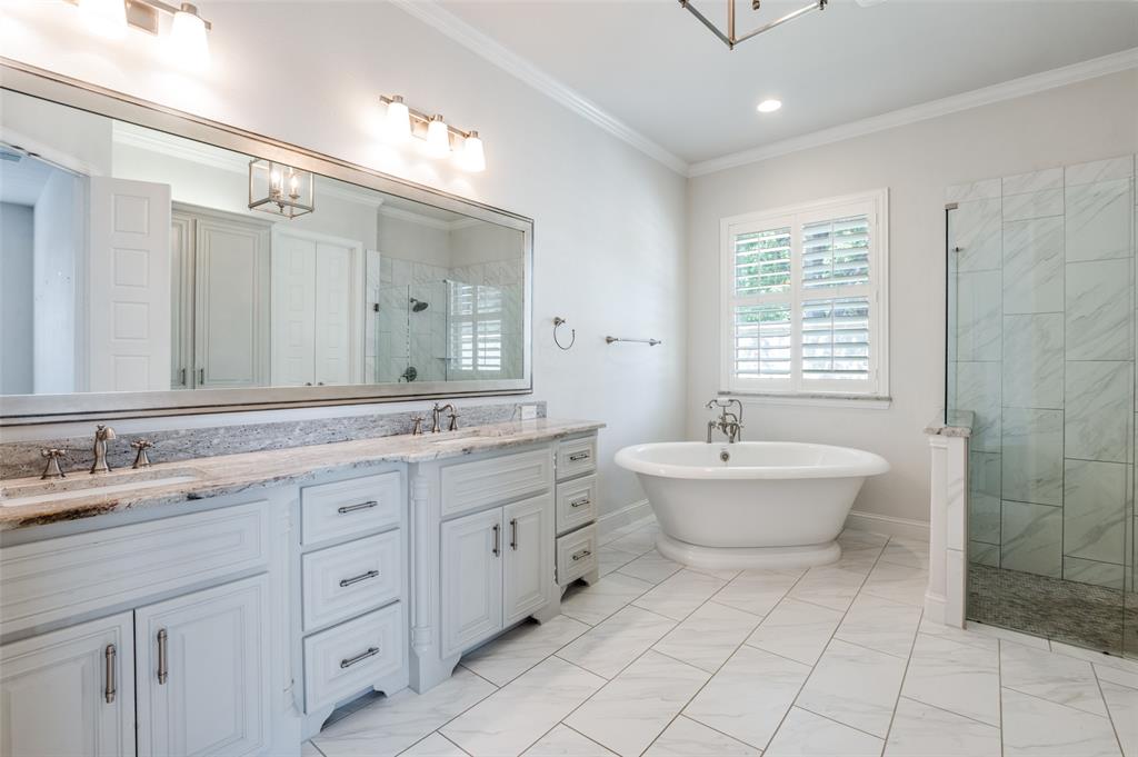 10482 Tobias Lane Frisco, TX 75033 - Photo 19 of 40 a bathroom with a granite countertop sink mirror and bathtub