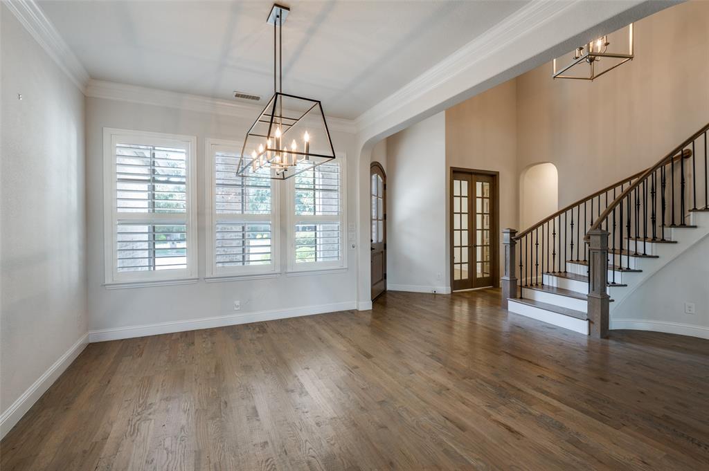 10482 Tobias Lane Frisco, TX 75033 - Photo 3 of 40 a view of empty room with wooden floor and fan