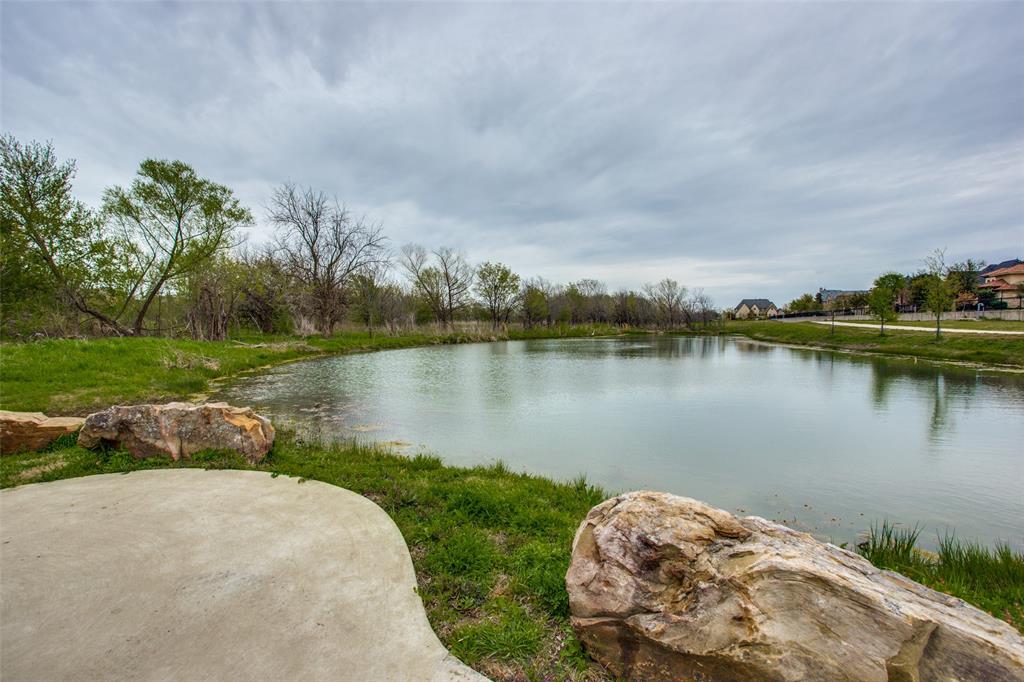 10482 Tobias Lane Frisco, TX 75033 - Photo 39 of 40 a view of a lake with houses in the back