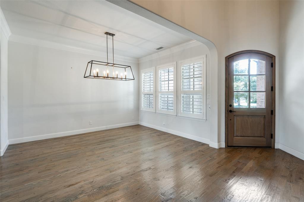 10482 Tobias Lane Frisco, TX 75033 - Photo 8 of 40 a view of an empty room with glass door and windows