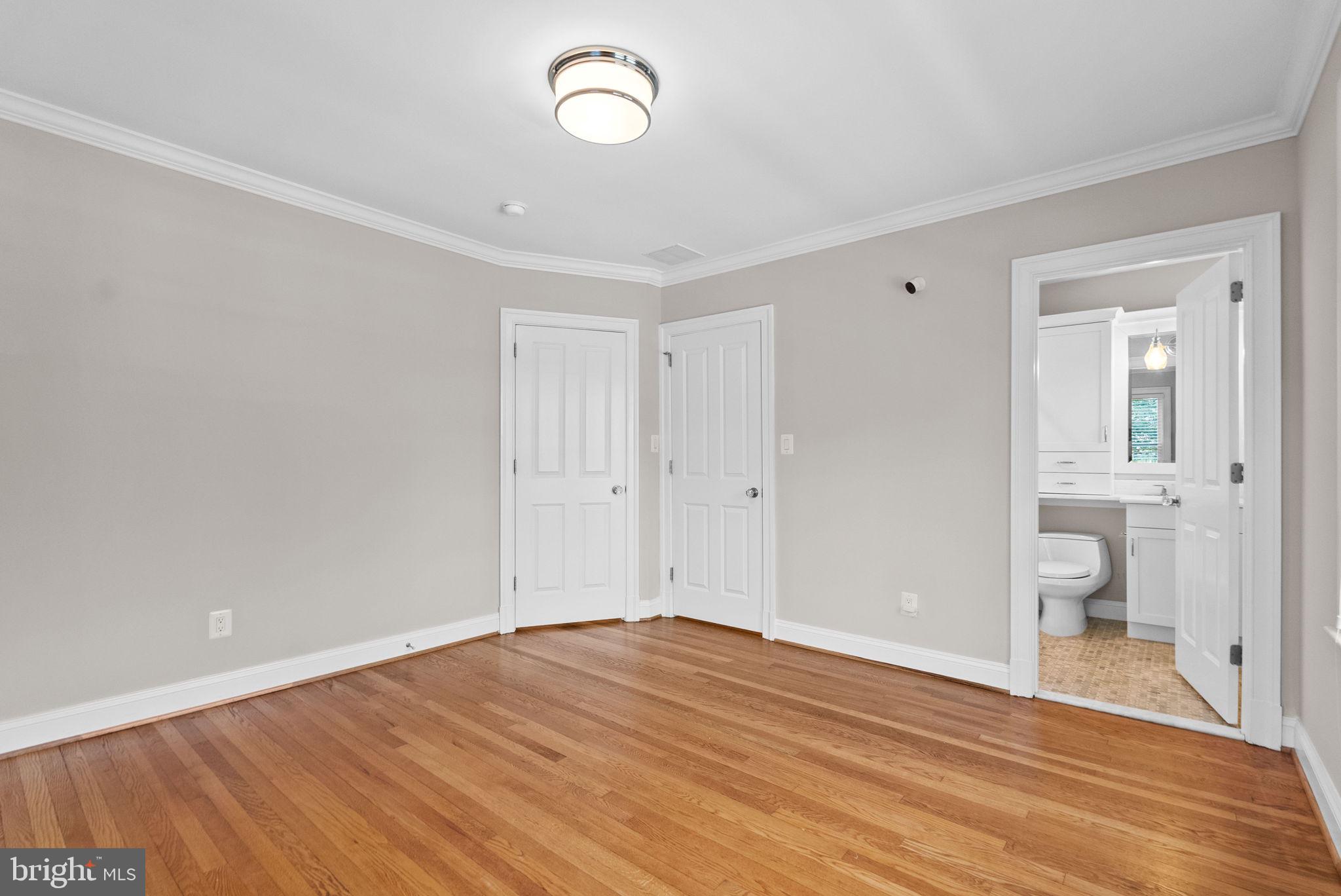 8013 Maple Ridge Road Bethesda, MD 20814 - Photo 54 of 72 a view of a room with wooden floor and bathroom