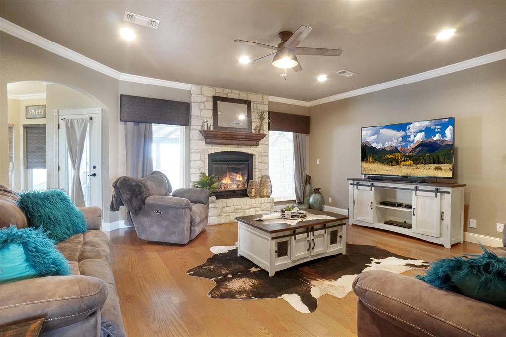 13340 John Day Road Haslet, TX 76052 - Photo 3 of 30 a living room with furniture and a fireplace