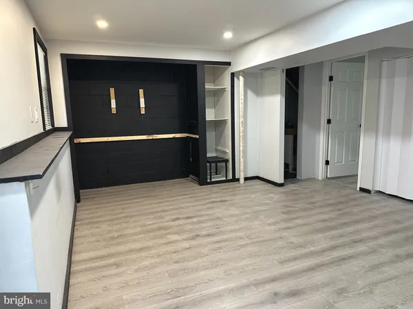 a view of a chairs and table on the wooden floor