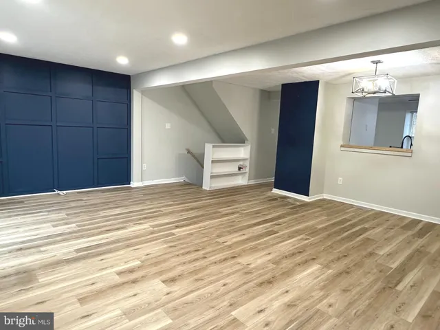 a view of a livingroom with wooden floor