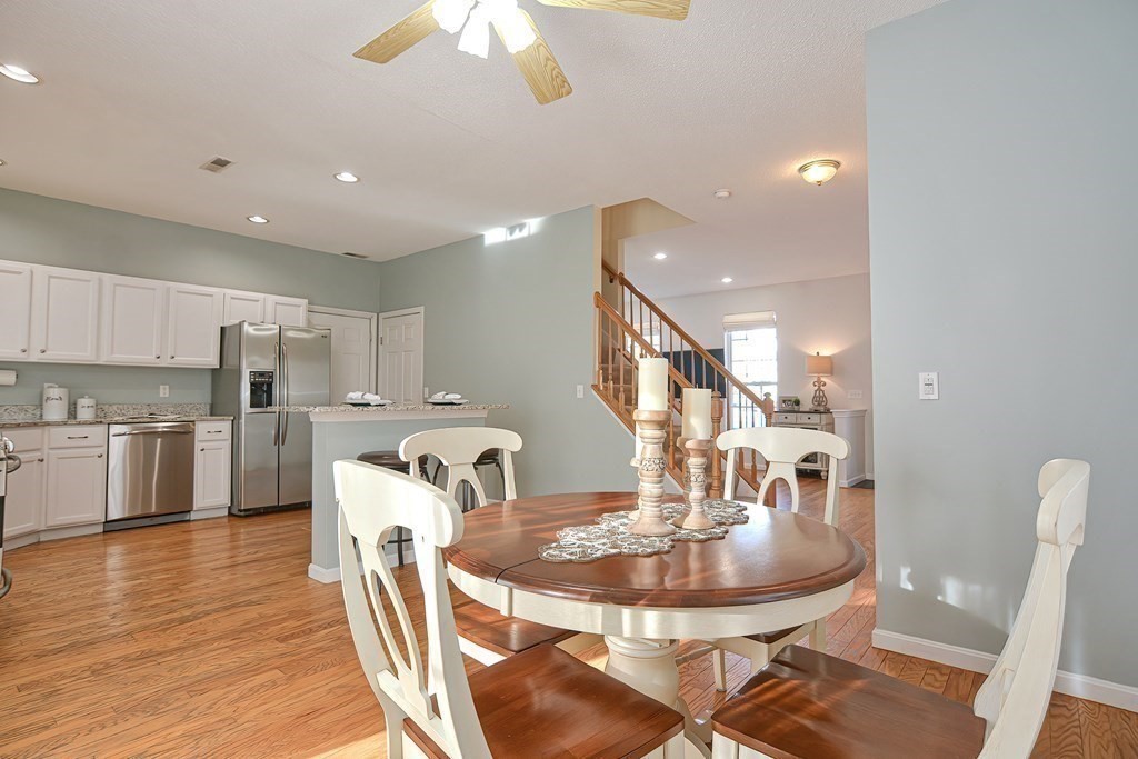 14 Robbins Road Foxboro, MA 02035 - Photo 12 of 42 a view of a dining room with furniture and wooden floor