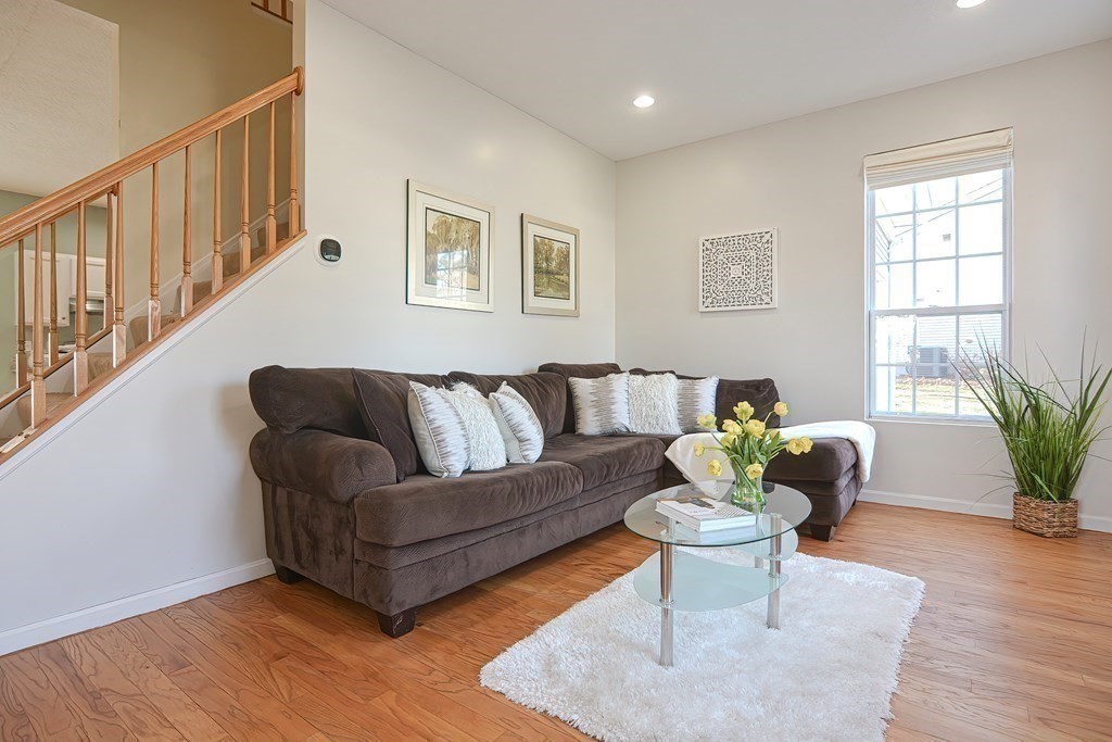 14 Robbins Road Foxboro, MA 02035 - Photo 16 of 42 a living room with furniture potted plant and wooden floor