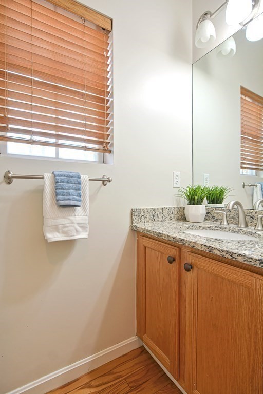 14 Robbins Road Foxboro, MA 02035 - Photo 20 of 42 a bathroom with a granite countertop sink and a mirror