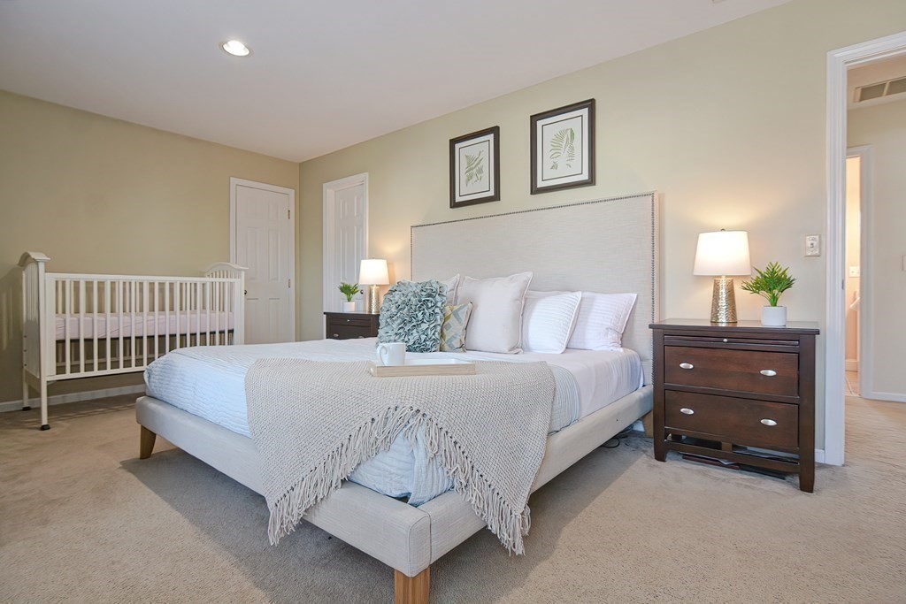 14 Robbins Road Foxboro, MA 02035 - Photo 21 of 42 a bedroom with a bed and a lamp