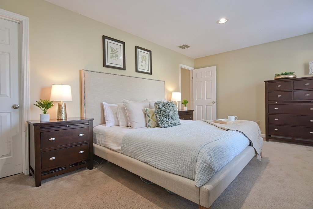 14 Robbins Road Foxboro, MA 02035 - Photo 22 of 42 a bedroom with a bed and a night stand